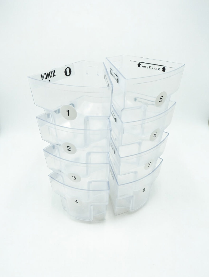 Set of clear plastic MedaCube bin containers with numbered labels on a white background