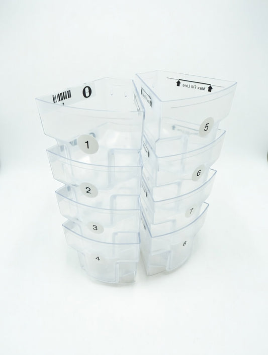 Set of clear plastic MedaCube bin containers with numbered labels on a white background
